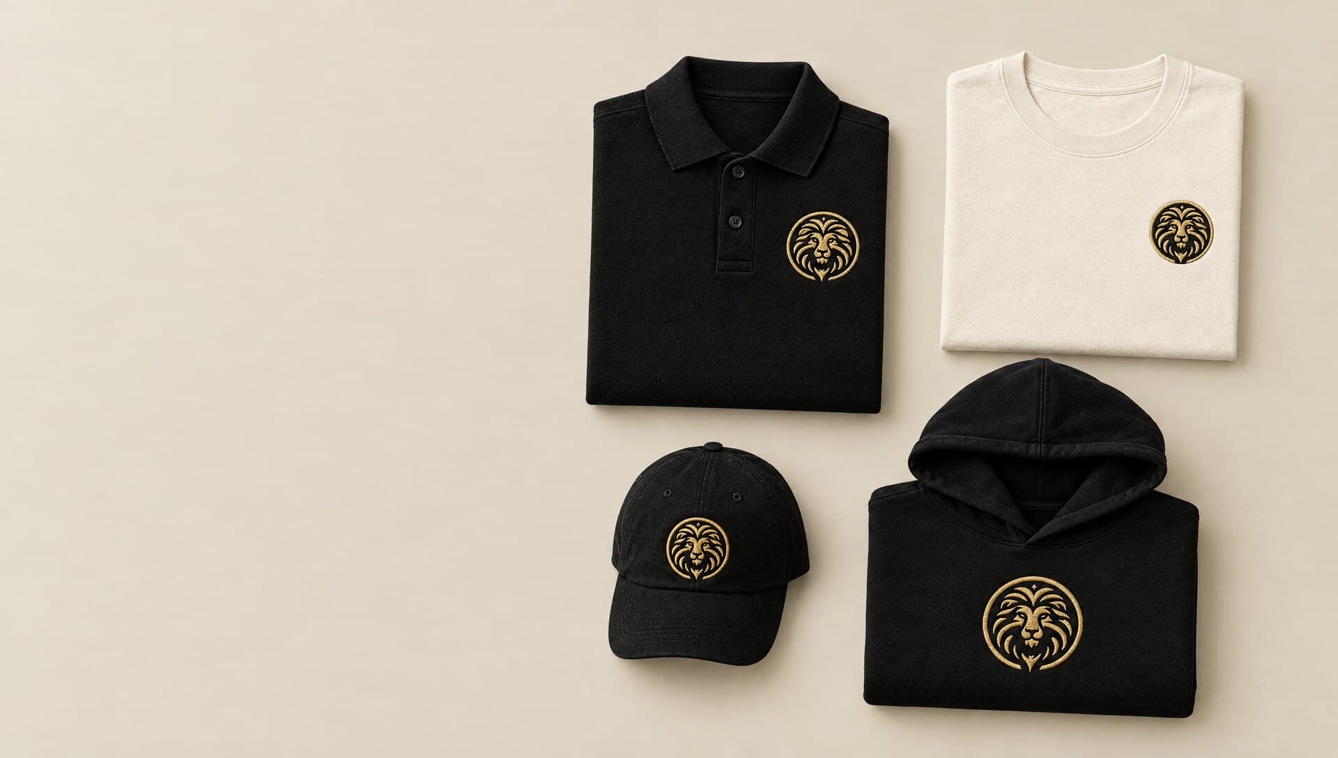 The Lion Polo, Tee, Hoodie and Dad Hat laid out together